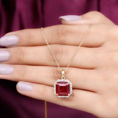 Product Details Elevate every look with the sparkling brilliance of our Classic Halo Pendant, which features a 10 mm asscher-cut created ruby elegantly set in prong setting surrounded by round petite moissanite creating a captivating halo frame, perfect for a striking look. Illuminate your fashion game with the charming allure of this ruby pendant comes with a delicate chain that offers both security and beauty. From casual wear to glamorous evening outfits, upgrade all your fits by wearing this Bridal Halo, Ruby Pendant, Halo Pendant, Asscher Cut, Evening Outfits, Delicate Chain, Prong Setting, Timeless Pieces, Round Shape