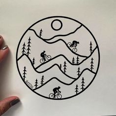 someone is drawing a mountain bike scene in the shape of a circle