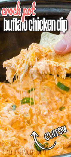 Close up of buffalo chicken dip on a tortilla chip held above a crock pot with more dip. Crockpot Buffalo Chicken Dip, Spicy Buffalo Chicken Dip, Buffalo Chicken Dip Crock Pot, Crockpot Buffalo Chicken, Buffalo Chicken Dip Easy, Spicy Buffalo Chicken, Crock Pot Dips, Dip Easy, Crockpot Chicken Breast