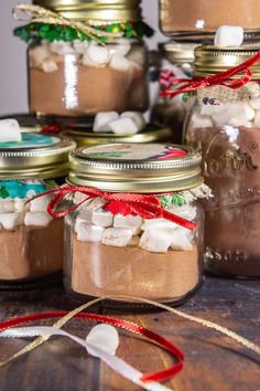 hot cocoa mix recipe in mason jars with text overlay that reads, hot cocoa mix recipe a perfect homemade christmas gift