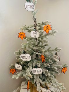 a decorated christmas tree with orange and white ornaments