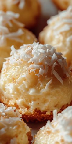 a close up view of some desserts with icing and sprinkles