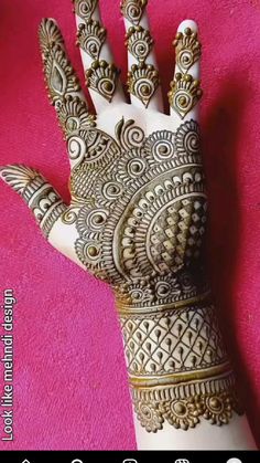 the hand is decorated with intricate designs