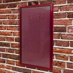 a brick wall with a red frame on it