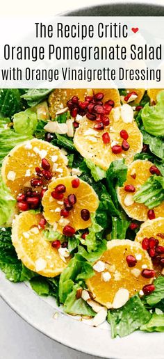 an orange and pomegranate salad with orange vinaigrete dressing