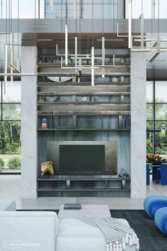 a living room filled with furniture and a flat screen tv sitting on top of a wooden shelf