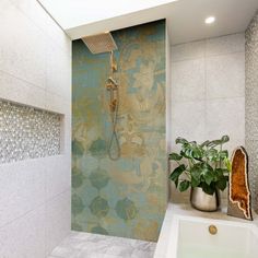 a bathroom with a sink, shower head and tiled walls in the back ground area