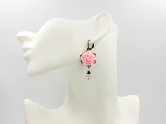 "These are romantic vintage inspired light pink rose earrings. They feature beautiful pink resin roses on top of brass floral filigrees and paired with natural rose quartz beads. They hang underneath leverback earrings. The earrings measure about 56mm (2.2 inches) from the top of the ear wire to the bottom of the pearl. They are perfect for occasions, a wonderful idea for gift giving and as a little treat for yourself. Your earrings will presented in a gift box and tied with ribbon. Measurements Pink Dangle Jewelry With Rose Design, Pink Rose Design Dangle Jewelry, Pink Rose Design Drop Earrings, Feminine Pink Jewelry With Rose Design, Pink Rose Design Jewelry For Wedding, Pink Victorian Earrings For Gift, Vintage Rose Gold Flower Earrings For Wedding, Victorian Pink Earrings For Wedding, Victorian Style Pink Earrings For Gift