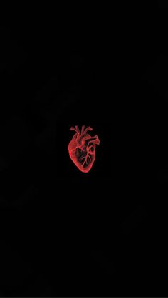 a red heart on a black background