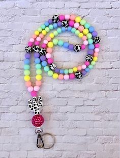 Brighten up your work attire with this lanyard! It's bright, colorful, and made to order! All lanyards come with a key ring attached.  These make great gifts for teachers, student teachers, coworkers, bosses, or as a stocking stuffer.  - Follow me on Instagram @chanslans Multicolor Badge Holder With Keychain For Gifts, Multicolor Badge Holder With Keychain As Gift, Multicolor Badge Holders With Keychain As Gift, Multicolor Lanyards With Key Leash For Personal Use, Fun Multicolor Lanyards For Gifts, Fun Multicolor Lanyards As Gifts, Multicolor Lanyard With Keychain For Everyday Use, Multicolor Lanyards With Key Clip For Gifts, Multicolor Lanyard With Key Clip For Gift