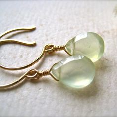 Our luminous Greens Earrings positively glow - and so will you! Like the first hint of spring and new growth awakening. Featuring two faceted Prehnite pear briolettes with a glowing lemongrass hue. We hand wire-wrap the gemstones in our signature tightrope style. The gems swing beneath our classic lure earwires. Perfect short and sweet go-with-anything style. Choose from affordable precious metals of Gold Fill, Sterling Silver, and Rose Gold Fill; or heirloom-quality solid 14K Gold (Yellow, Rose Minimalist Jewelry Earrings, Drop Earrings Simple, Gemstone Drop Earrings, Sage Green Wedding, Short And Sweet, Creating Jewelry, Demi Fine Jewelry, Green Earrings, New Growth