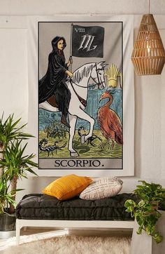 a white horse with a rider on it's back in front of a wall hanging