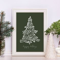 a christmas tree is displayed in a white frame