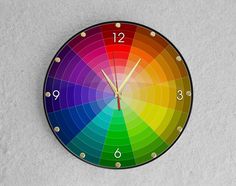 a clock with multiple colors on the face