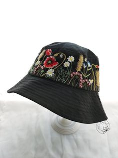 a black hat with flowers on it