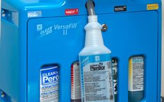 a blue machine with three different types of cleaners on it's front and side