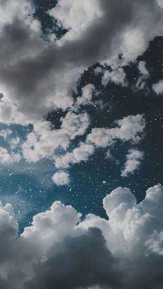 the sky is filled with clouds and stars