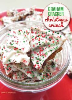 graham cracker christmas crunch with white frosting and sprinkles in a glass bowl