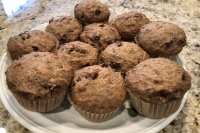 a white plate topped with chocolate muffins on top of a counter