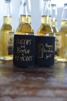 some beer bottles are sitting on a table with happy 40 years written on the labels