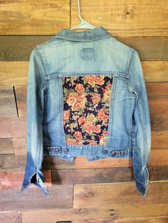 I'm in LOVE with this. The flower pattern on the back is a corduroy material. A great way to add some fun to any outfit! *Every item is previously owned, worn and then repurposed. There will be wear in each piece. Long Sleeve Cotton Denim Jacket With Floral Print, Trendy Denim Jacket With Floral Print, Trendy Floral Print Denim Jacket, Trendy Denim Floral Print Outerwear, Spring Denim Jacket With Patches In Dark Wash, Casual Cotton Denim Jacket With Floral Print, Casual Floral Print Denim Jacket For Fall, Fitted Casual Denim Jacket With Floral Print, Casual Fitted Denim Jacket With Floral Print