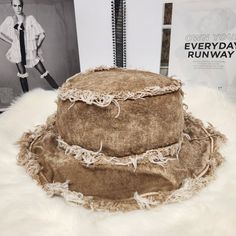 This Stylish And Trendy Tan Distressed Bucket Hat Is Perfect For Any Fashion-Conscious Woman. Made From High-Quality Denim Fabric, This Hat Is Both Durable And Comfortable To Wear. Its Distressed Design Adds A Touch Of Rugged Appeal, Making It The Ideal Accessory For Any Casual Outfit. With Its One-Size-Fits-Most Design, This Bucket Hat Is Suitable For Women Of All Sizes. Its Brown Color Is Versatile And Can Be Paired With Any Outfit. The Hat's Style Is Unique And Fashionable, Making It A Must-H Bohemian Distressed Summer Hats, Distressed Brown Summer Hat, Distressed Wide Brim Hat For Summer, Distressed Wide Brim Summer Hat, Vintage Washed Hats For Summer, Vintage Washed Summer Hats, Vintage Distressed Beach Hat, Summer Distressed Adjustable Bucket Hat, Adjustable Distressed Bucket Hat For Summer