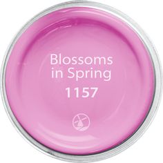 a pink bowl with the words blossoms in spring written on it's bottom side