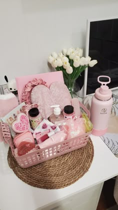 a basket filled with pink items on top of a table