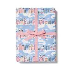 a wrapped gift box with a pink ribbon