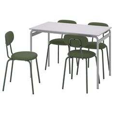 a white table with four green chairs and a white rectangular table on the left side