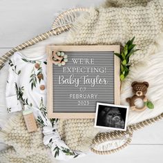 a baby's birth announcement is displayed on a blanket next to its teddy bear