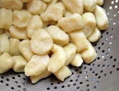 some kind of food that is in a metal bowl