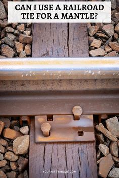 an image of railroad tracks with the words can i use a railroad tie for a mantle?