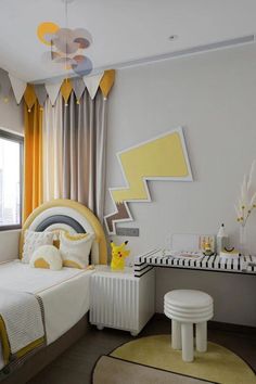 a bedroom decorated in yellow and gray with a bed, desk, chair, rug and window