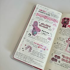 an open notebook with writing and doodles on the pages in english, chinese and japanese