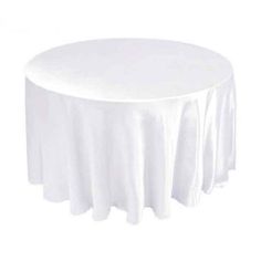 a round table with white cloth on it