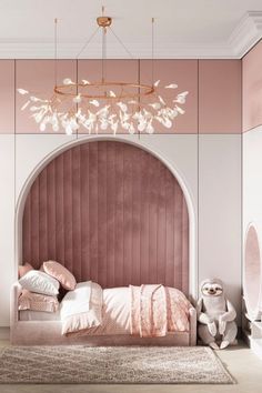 a bedroom with a pink headboard and chandelier hanging from it's ceiling