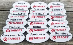 ten target stickers are arranged on top of a wooden table, with the words target written in red