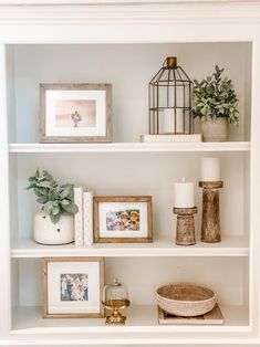 shelves with pictures, candles and other items on them