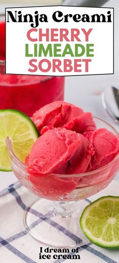 a bowl filled with ice cream next to limes and a cup full of liquid