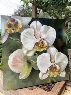 an oil painting of three white orchids on a green background in a garden setting