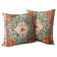 two decorative pillows with an orange, blue and green design on the front one is square