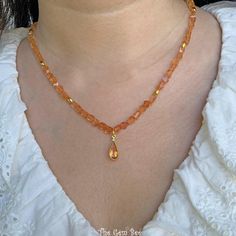 Thank you for coming in!  Breath-taking gem imperial topaz nugget bead necklace with a beautiful center pendant and 18k solid gold spacers and clasp! 17" to 19" adjustable length necklace! You'll get the necklace you see! SIZE of the beads: 5.2mmx4mm-5mmx6mm, 6.68mmx13mm bezel MATERIAL: 18k solid gold, Imperial Topaz Gold Citrine Beaded Necklace For Gift, Elegant Orange Crystal Necklaces With Gemstone Beads, Gold Rondelle Crystal Necklace With Gemstone, Gold Single Strand Gemstones As Gift, Gold Beaded Gemstones As Gift, Gold Beaded Gemstones For Gift, Beaded Gold Gemstones For Gift, Pear Pendant, Imperial Topaz