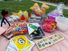 the table is covered with candy and snacks