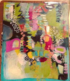 an abstract painting is being worked on with acrylic paint