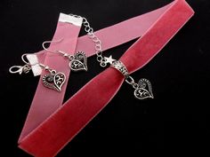 "This is a pretty hand made pink velvet choker necklace and earrings with a tibetan silver heart charm. The velvet is 16mm wide (approx one inch). Measures approx. 13\" long plus a 1.5 inch extension chain. If you would like a longer, or shorter length, let me know, and i'll make the size you want. Thanks for looking!" Heart Charm Choker For Party, Adjustable Dangle Choker For Gift, Adjustable Dangle Choker As Gift, Handmade Pink Choker As A Gift, Silver Adjustable Choker For Valentine's Day, Adjustable Silver Choker For Valentine's Day, Handmade Pink Choker As Gift, Valentine's Day Adjustable Silver Choker, Valentine's Day Silver Adjustable Choker