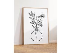 a black and white drawing of flowers in a vase on a wall next to a wooden floor