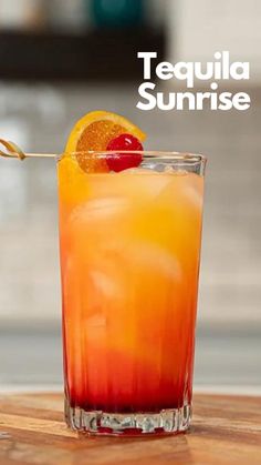 the tequila sunrise cocktail is garnished with an orange slice