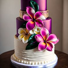 a three tiered cake with purple and white flowers