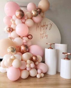 a bunch of balloons that are on top of a table